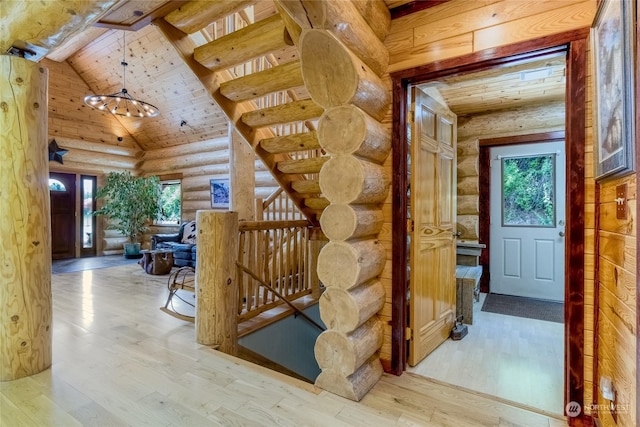 hall featuring high vaulted ceiling, beam ceiling, wooden ceiling, and light wood-type flooring