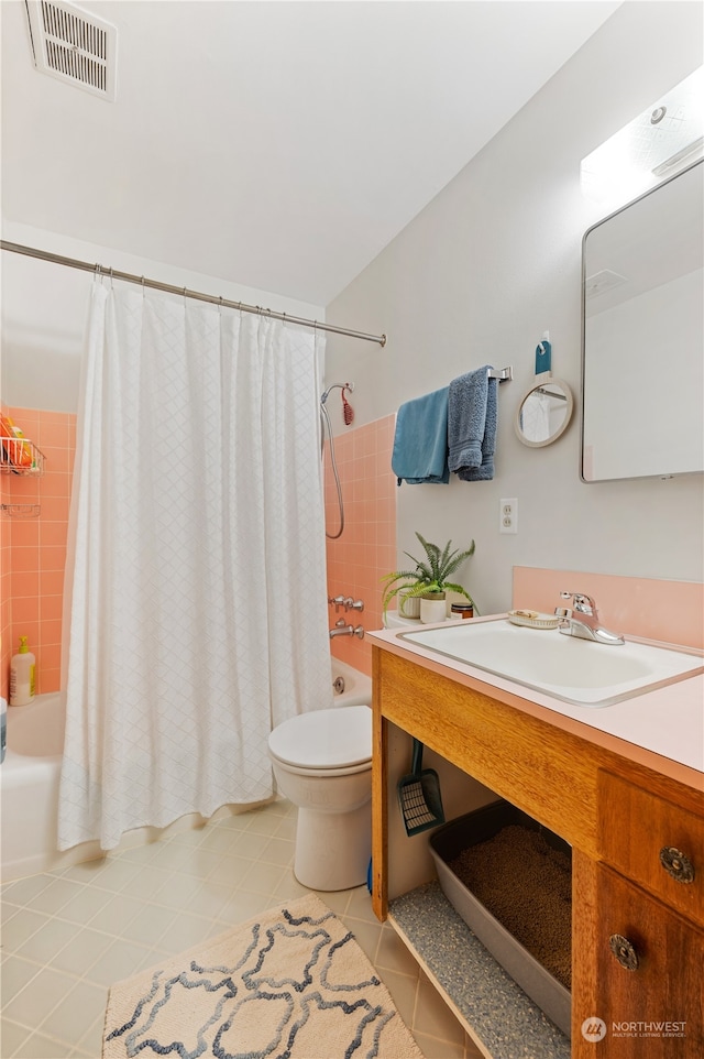 full bathroom featuring shower / bathtub combination with curtain, tile flooring, vanity, and toilet