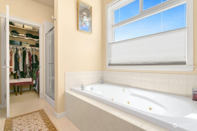 bathroom featuring separate shower and tub and tile patterned flooring