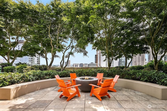 view of patio / terrace featuring an outdoor fire pit