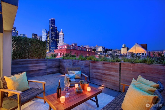 view of patio terrace at dusk