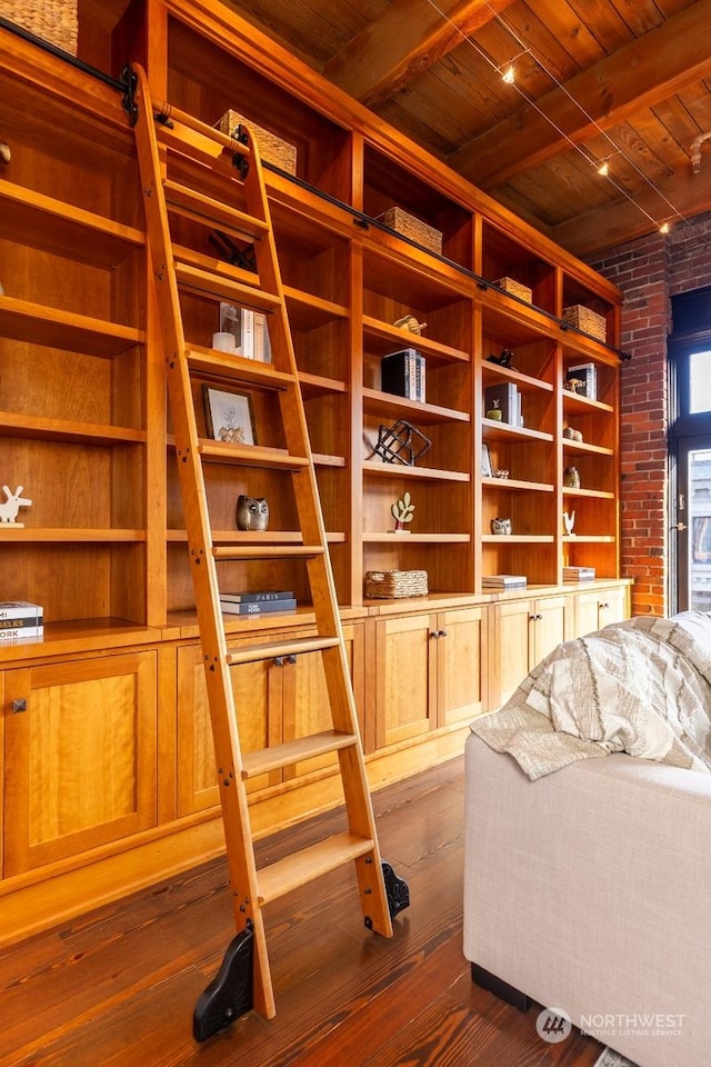 interior space with dark hardwood / wood-style floors and wood ceiling