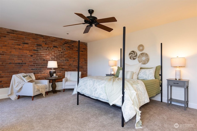 carpeted bedroom featuring ceiling fan and brick wall