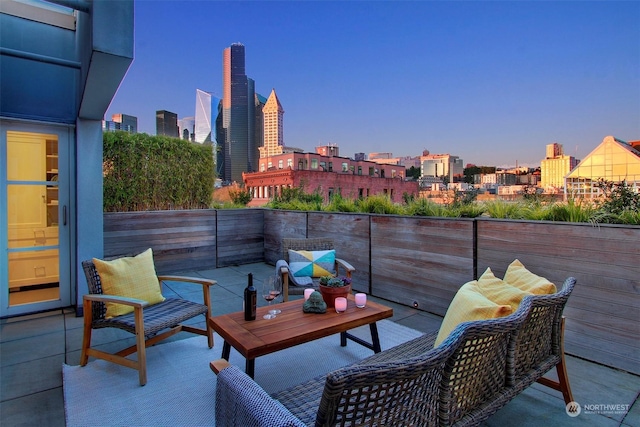 view of patio terrace at dusk