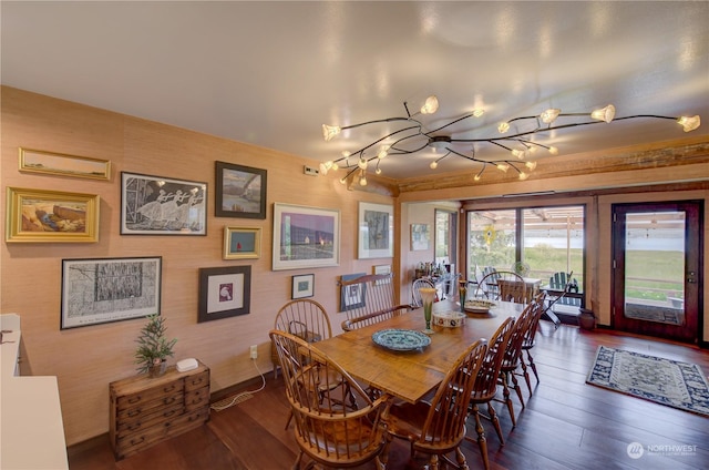 dining space with wood-type flooring