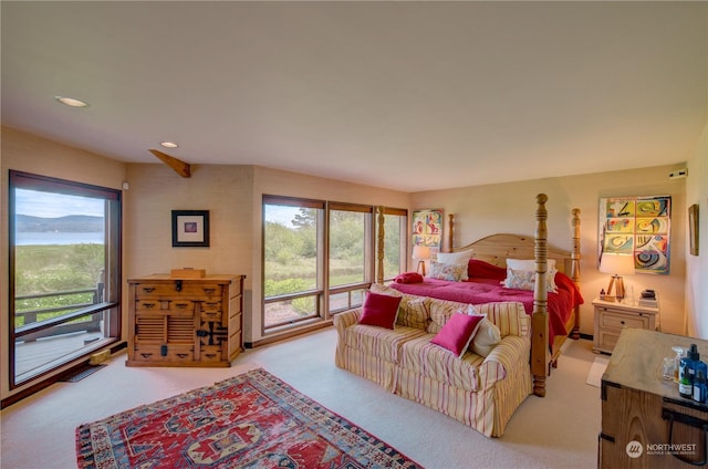 bedroom featuring light carpet and access to outside