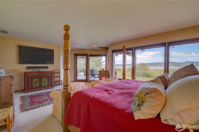 carpeted bedroom featuring access to outside