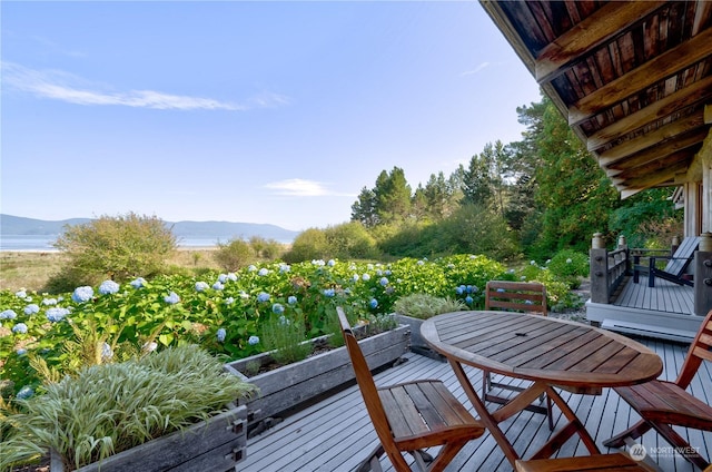 balcony with a deck with water view