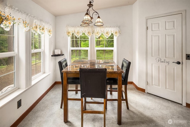 81 Hawthorn Ln, Easton, WA 98925 - dining space featuring baseboards and a chandelier