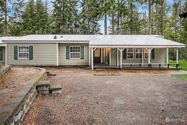 81 Hawthorn Ln, Easton, WA 98925 - rear view of property with a porch and a metal roof