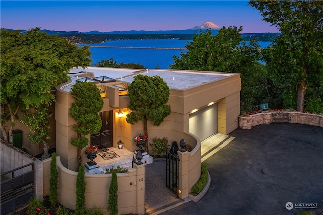 exterior space featuring a water and mountain view