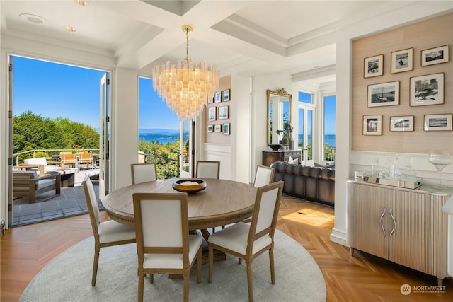 dining area featuring coffered ceiling, a chandelier, plenty of natural light, and light parquet floors