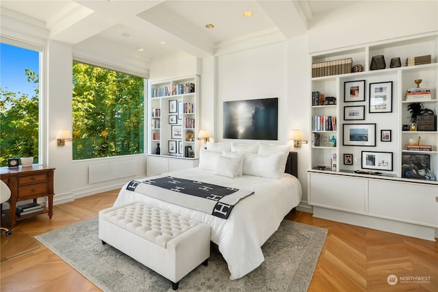 bedroom with beamed ceiling, light parquet floors, and coffered ceiling