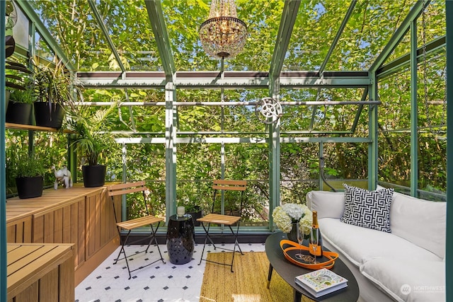 sunroom featuring a chandelier