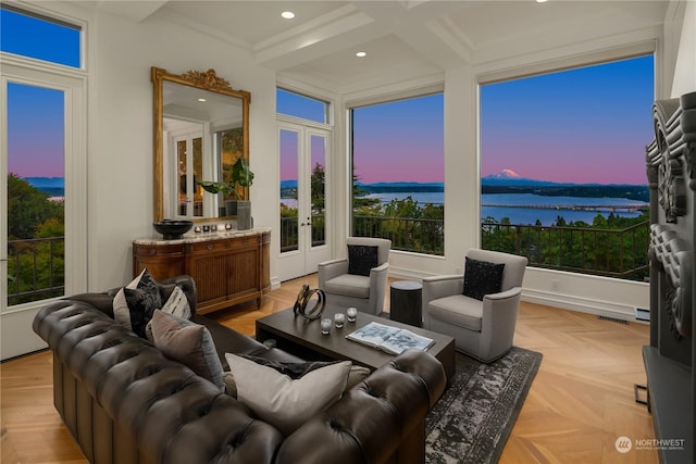 sunroom featuring beamed ceiling, a water view, and coffered ceiling