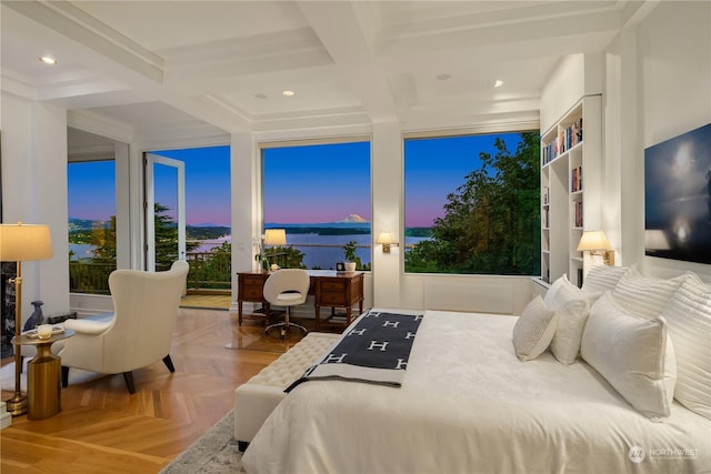 bedroom featuring beamed ceiling, a water view, and light parquet floors