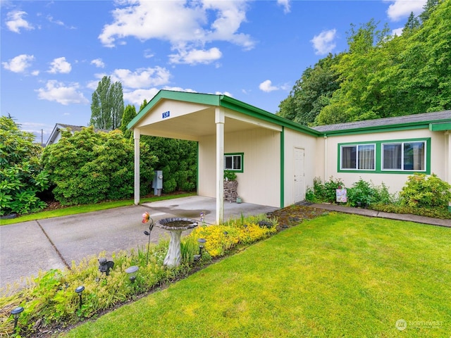 exterior space featuring a carport and a front yard