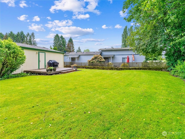 view of yard featuring a deck