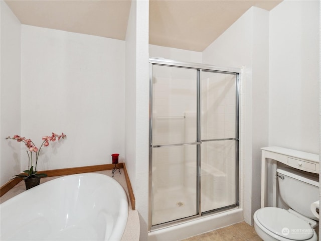 bathroom with toilet, tile patterned floors, and independent shower and bath