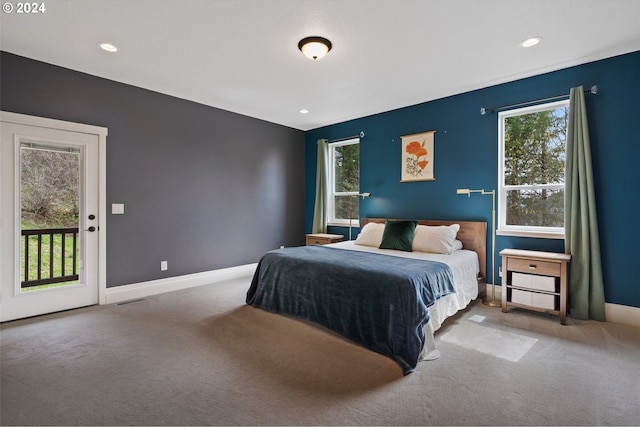 carpeted bedroom featuring access to outside