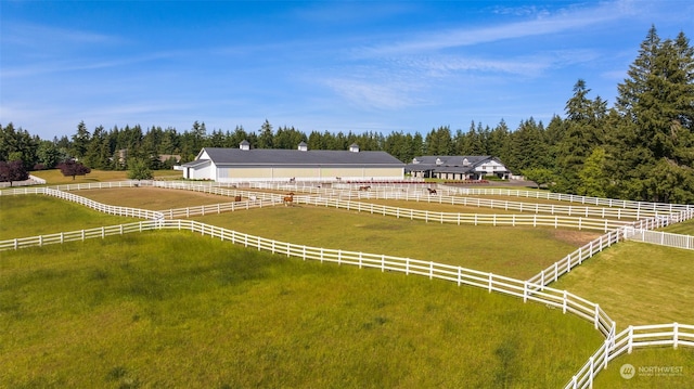 birds eye view of property with a rural view