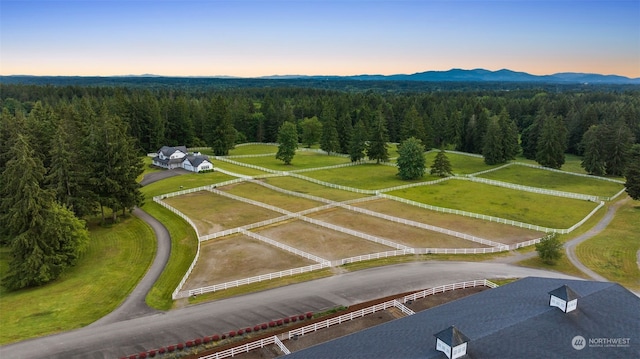 aerial view at dusk featuring a rural view