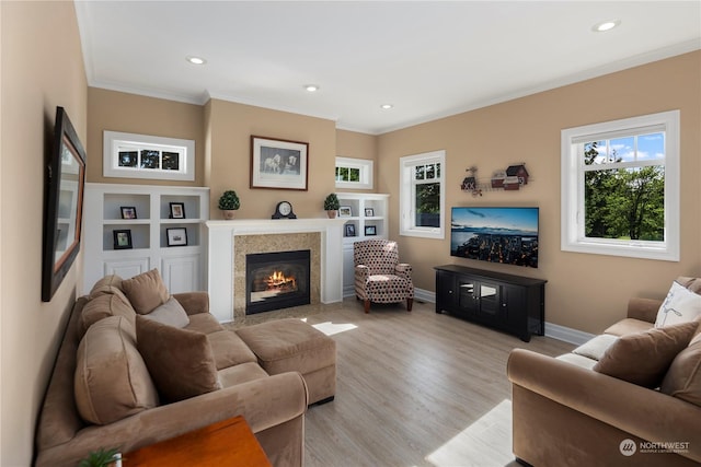 6504 44th Ave NE, Olympia, WA 98516 - living room featuring ornamental molding, recessed lighting, baseboards, a fireplace, and light wood-type flooring