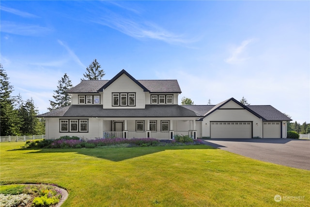 view of front facade featuring a garage and a front lawn