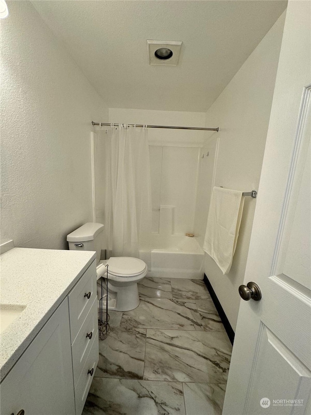 full bathroom featuring vanity, toilet, and shower / bath combo with shower curtain