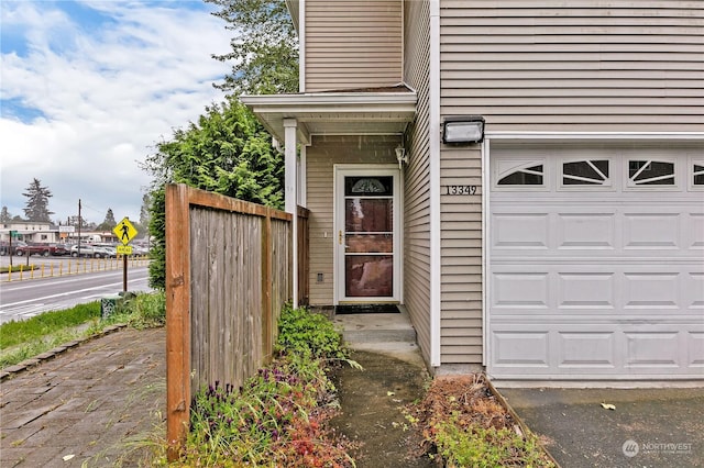 entrance to property featuring a garage