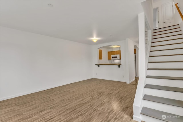 unfurnished living room featuring light hardwood / wood-style floors