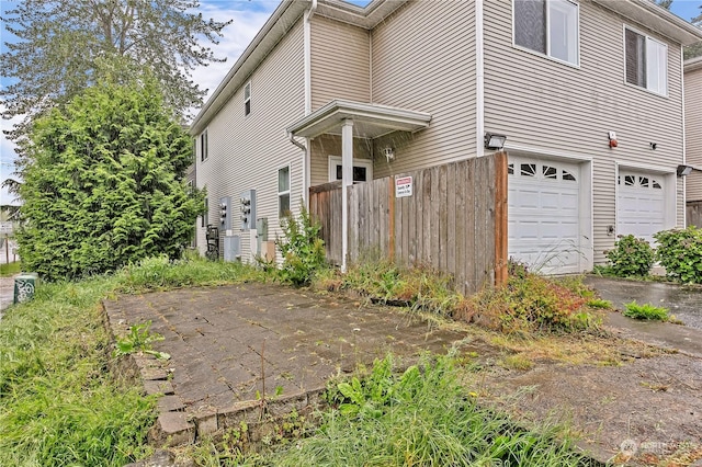 exterior space with a garage