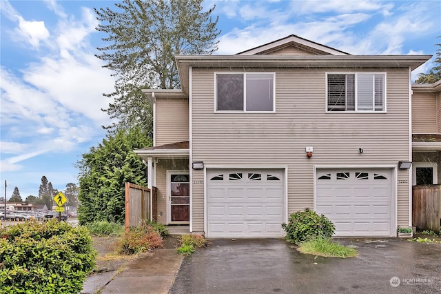 front facade with a garage