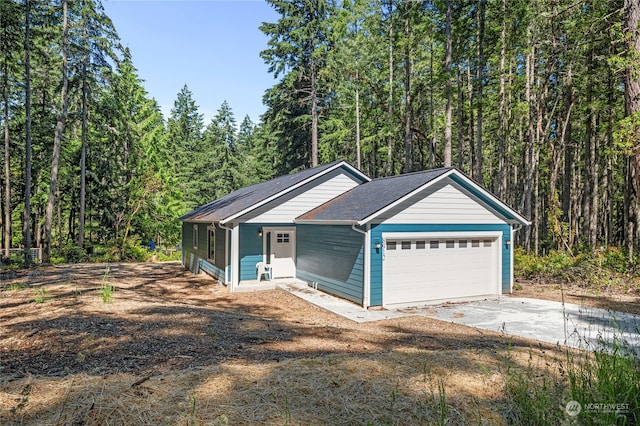 view of front of property with a garage and a porch