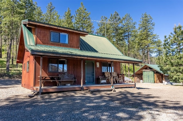 view of front facade featuring an outdoor structure and a porch