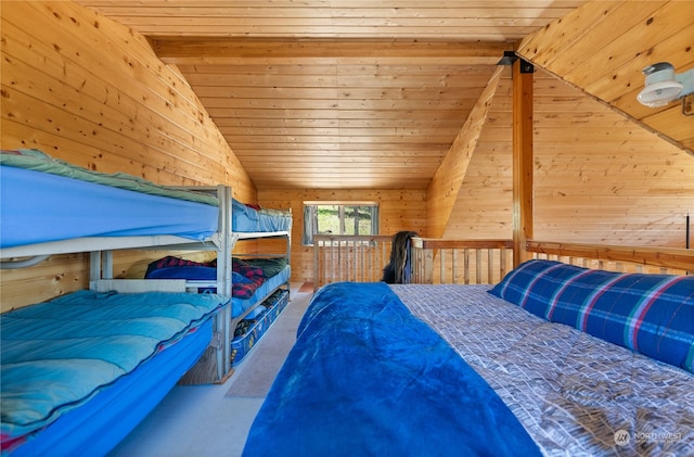 carpeted bedroom featuring vaulted ceiling and wood ceiling