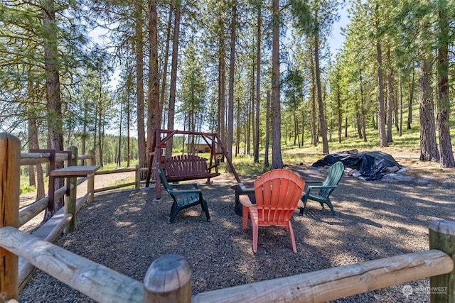 view of terrace featuring an outdoor fire pit