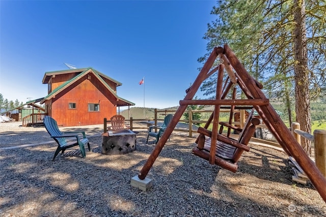 view of play area with a fire pit