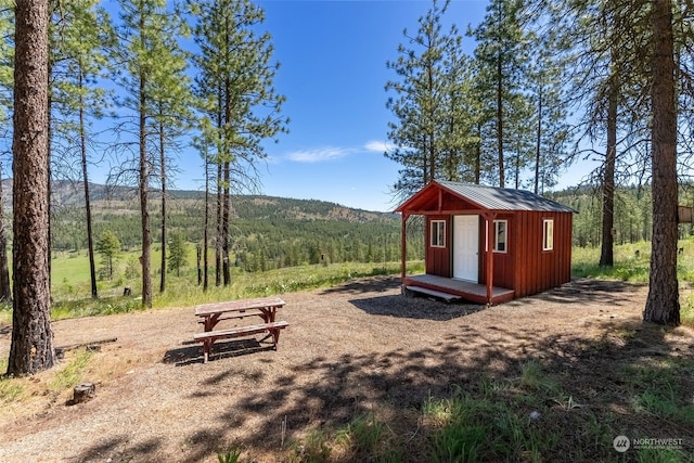 view of play area featuring a storage shed