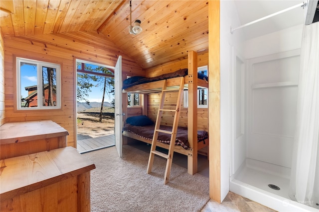 bedroom featuring wood walls, lofted ceiling, carpet flooring, and wooden ceiling