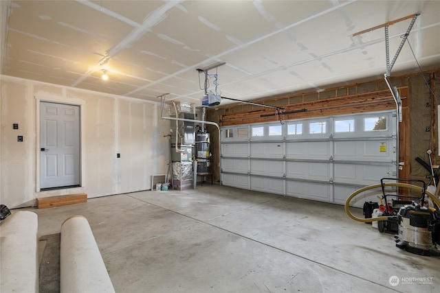 garage featuring a garage door opener and water heater