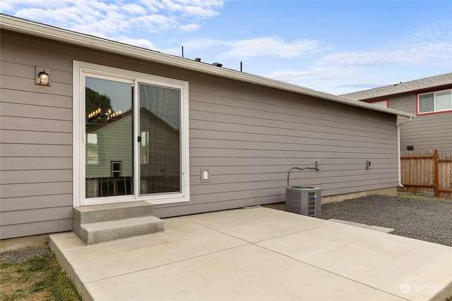 exterior space with central AC and a patio area