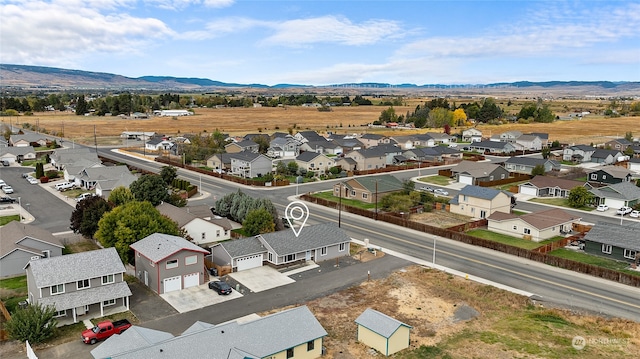 birds eye view of property with a mountain view