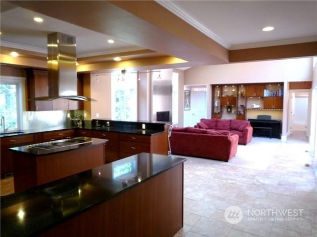 kitchen with a kitchen island, stovetop, sink, ventilation hood, and light tile floors