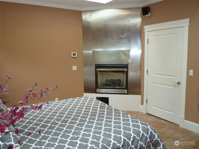 bedroom featuring ornamental molding and tile floors