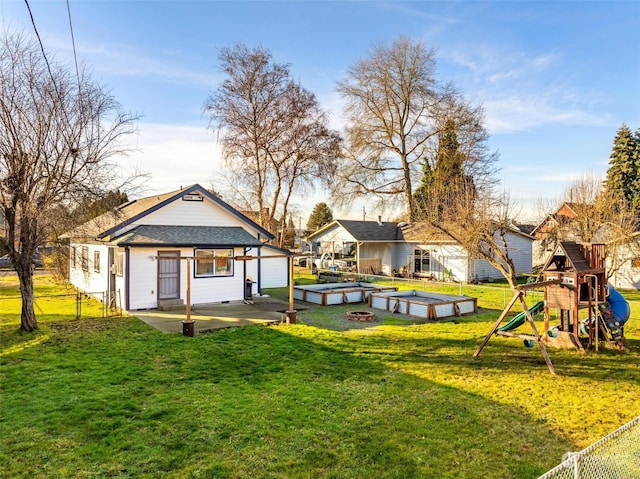 view of yard with a patio and a playground