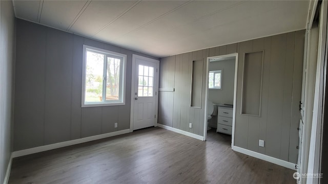 unfurnished bedroom featuring dark hardwood / wood-style floors