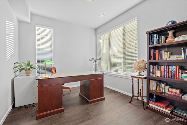 office with dark wood-type flooring