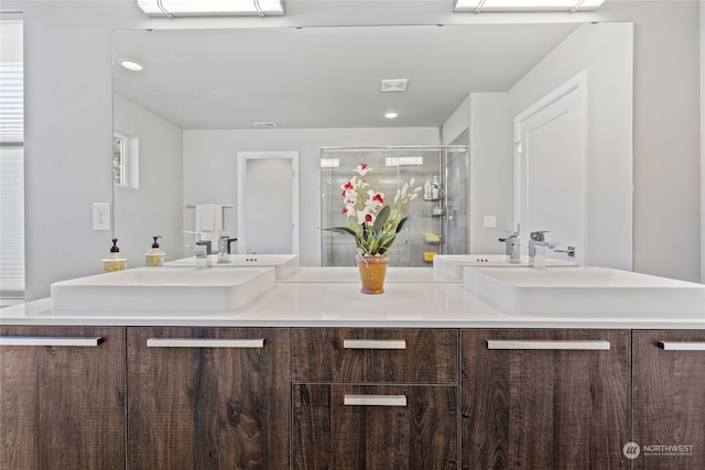 bathroom featuring vanity and walk in shower