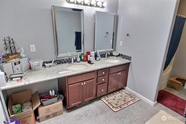 bathroom featuring vanity and shower / bath combo with shower curtain